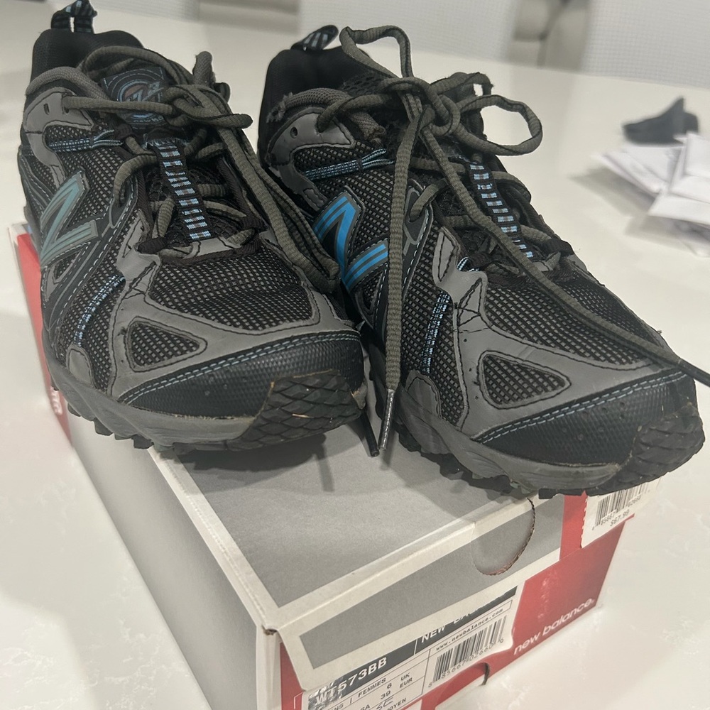 New Balance Black and Gray Trail Shoes with Blue Accents